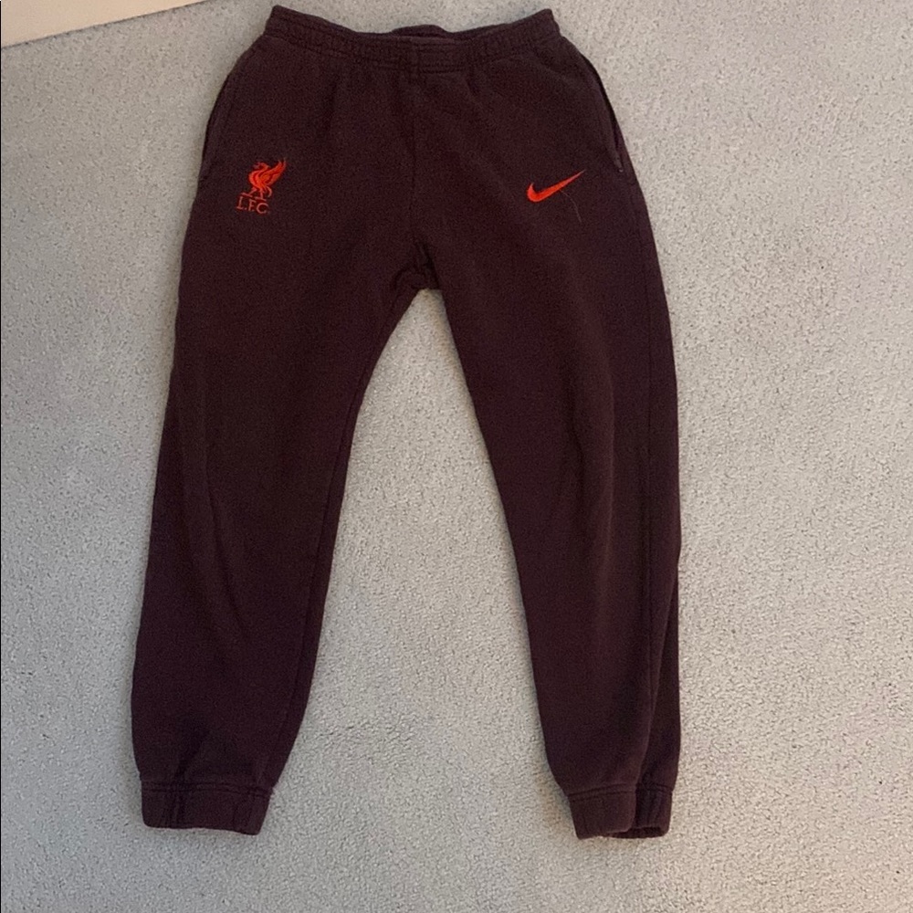 Nike Kids Black Joggers with Red Logo
